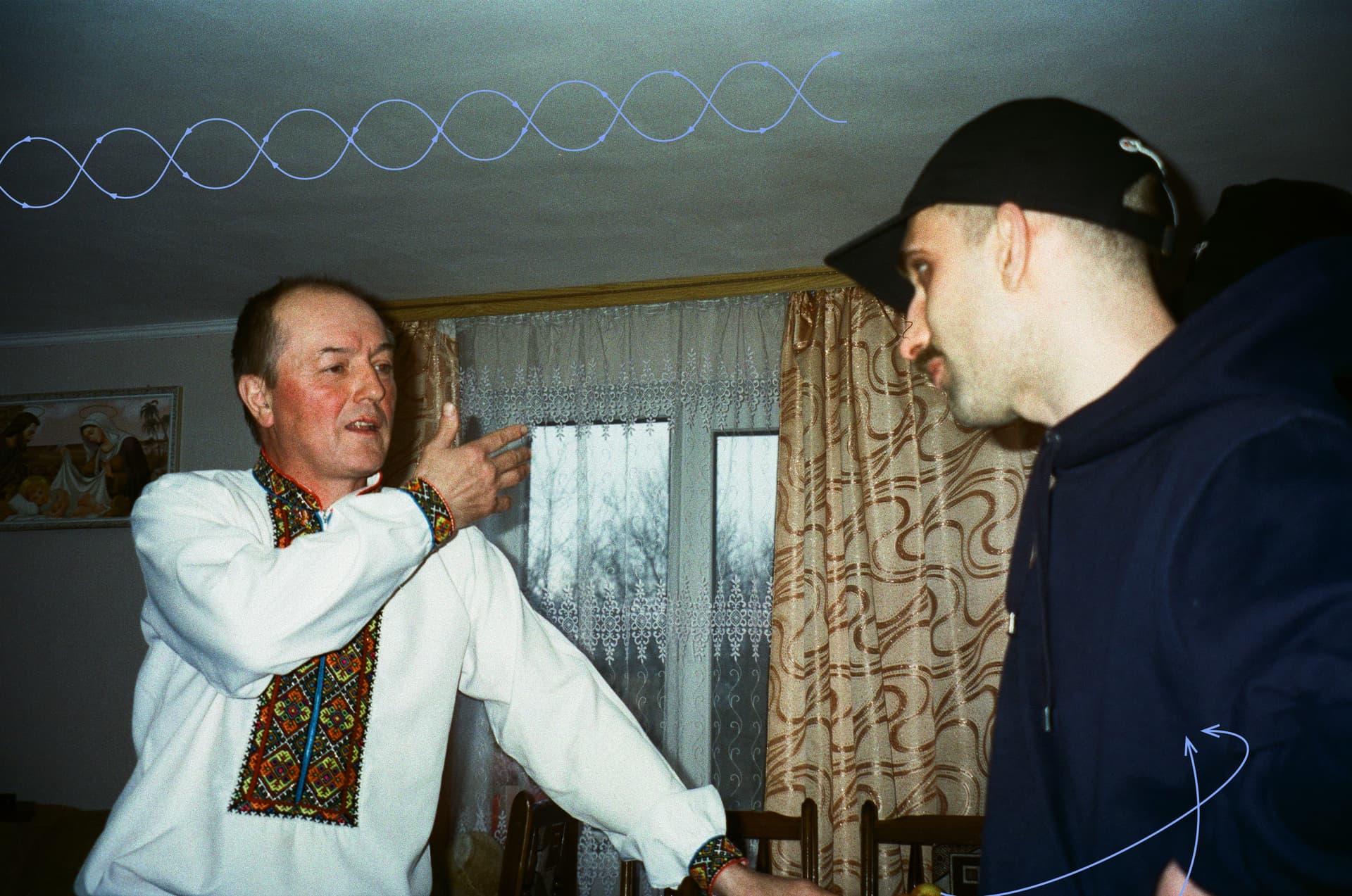 Oleksii Makarenko talks to cymbalist Vasyl Tymchuk in a house in the village of Verkhovyna in Prykarpattia