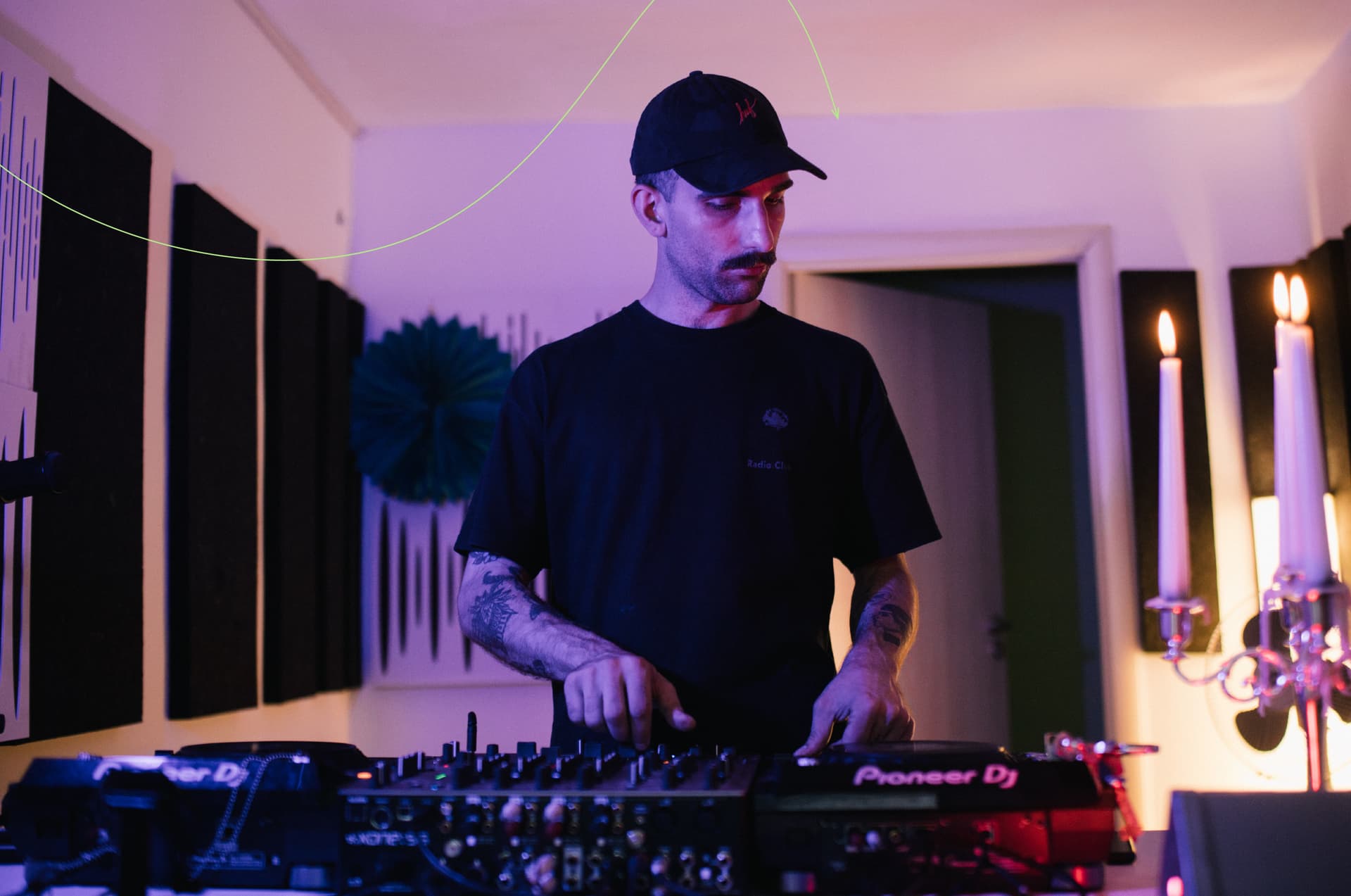 Oleksii Makarenko DJing on a set of CDJs